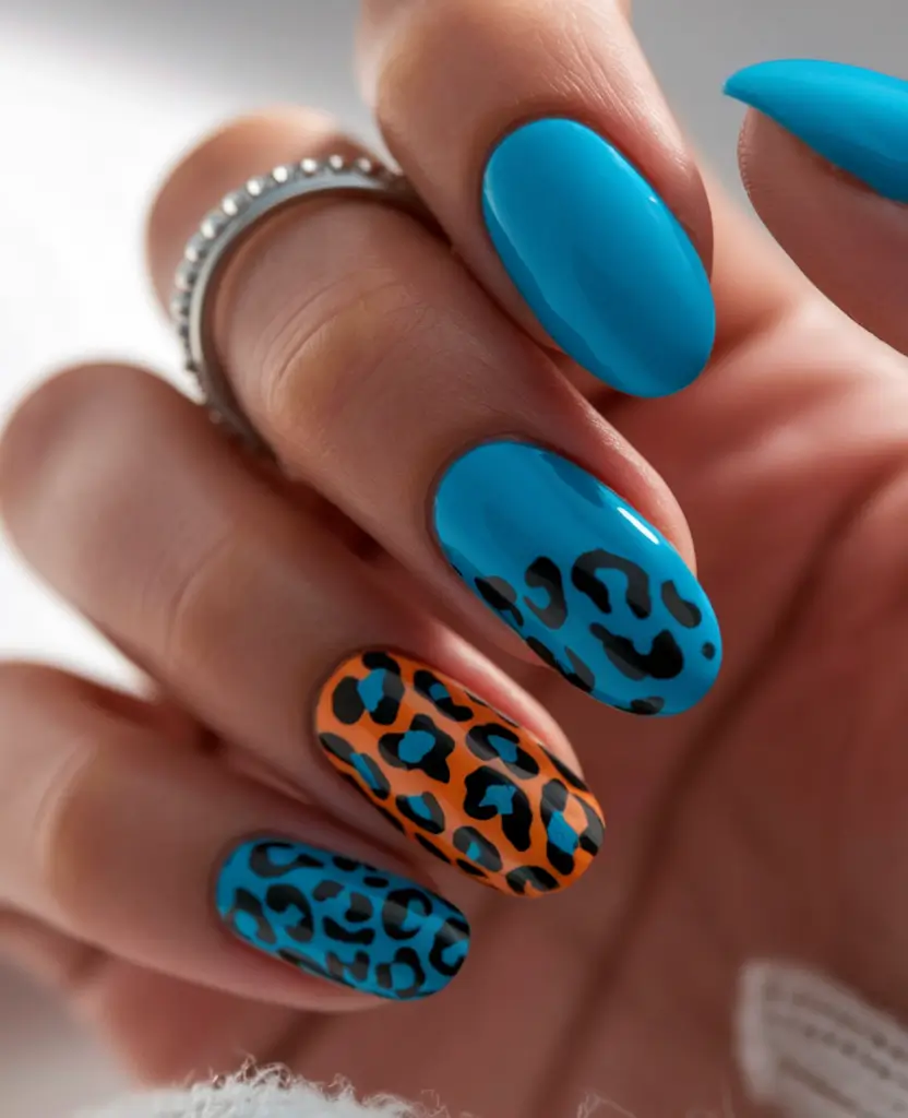 Summer 2025 Nail Designs to Try Wild Prints in Electric Blue and Orange