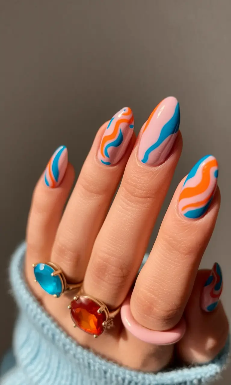 Oval Nail Inspo for Summer 2025 Looks Retro Wavy Dreams in Orange and Aqua
