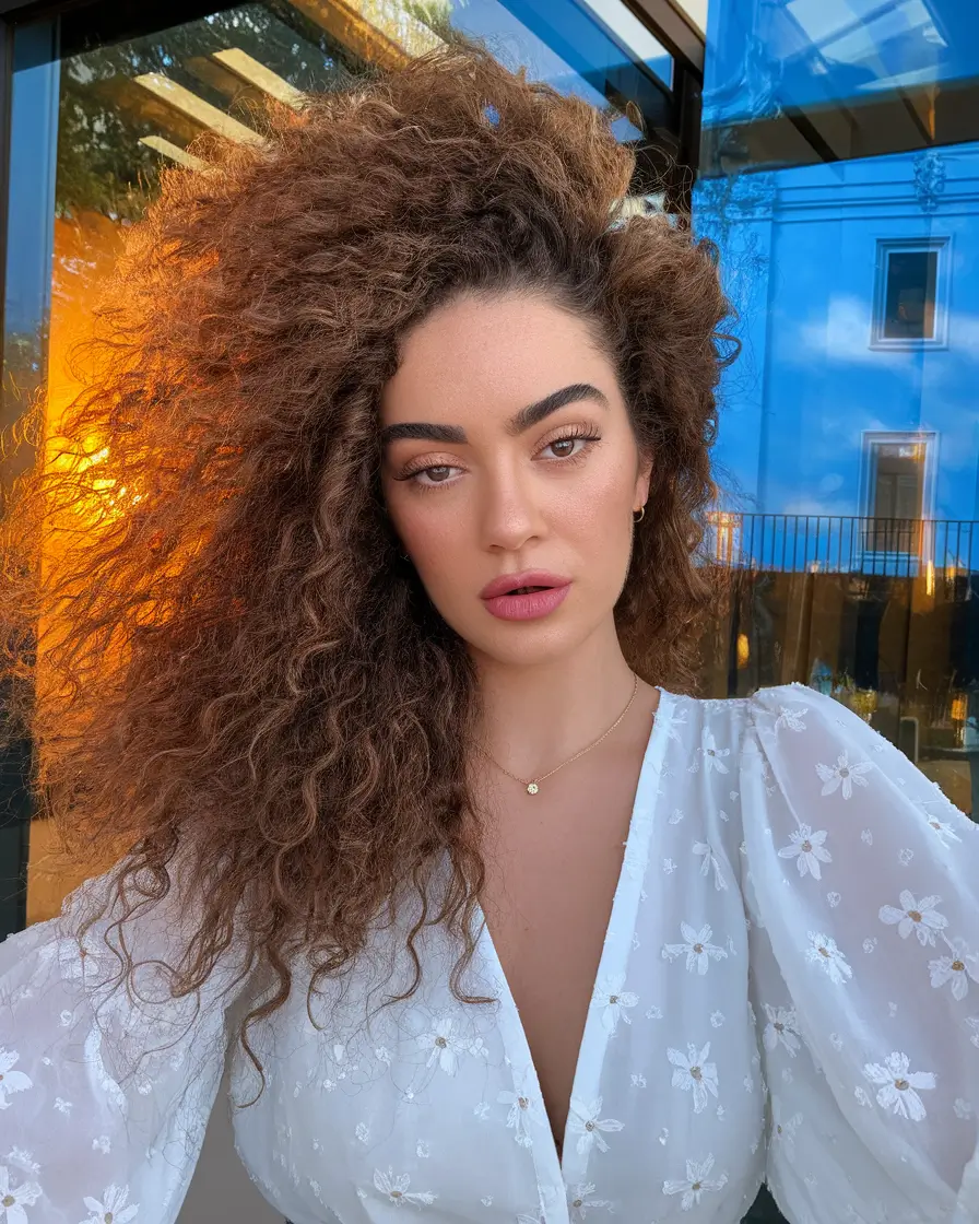 Fall 2025 Hair Colors for Warm Skin Tones+Wild Textured Curls in Cinnamon Tones
