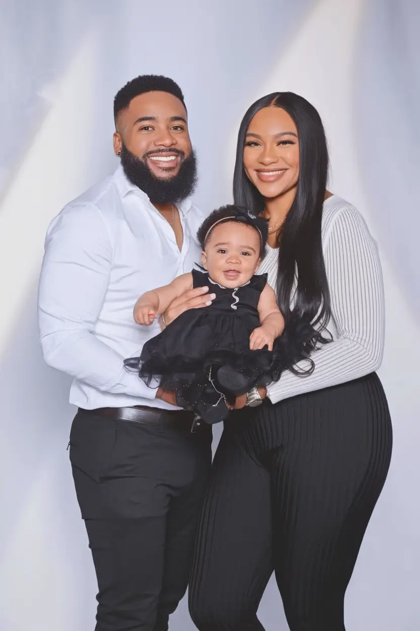 fall family photo outfits ideas 2025+Bold Contrast in Black and White with a Baby Pop