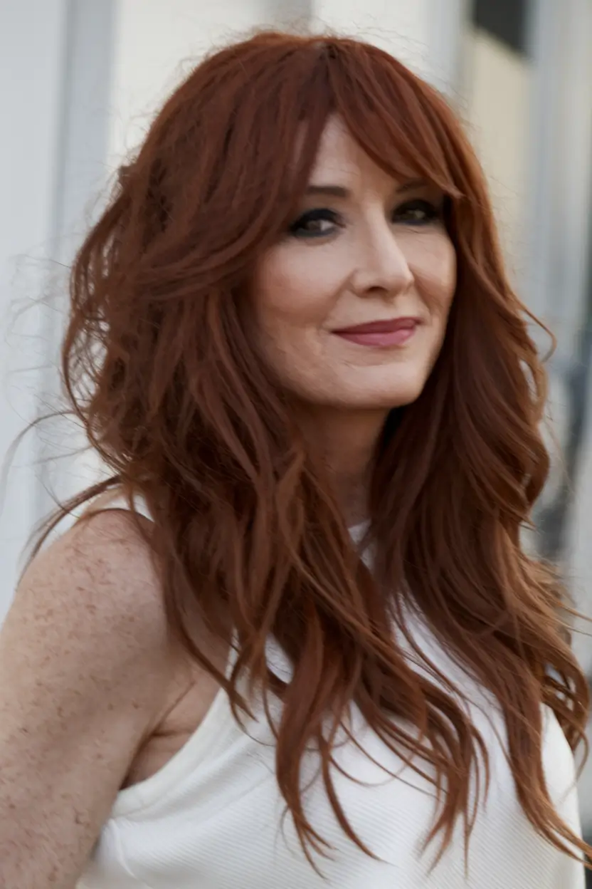 Fall hair color ideas 2025 for women over 40 Copper Cinnamon Layers with Curtain Bangs
