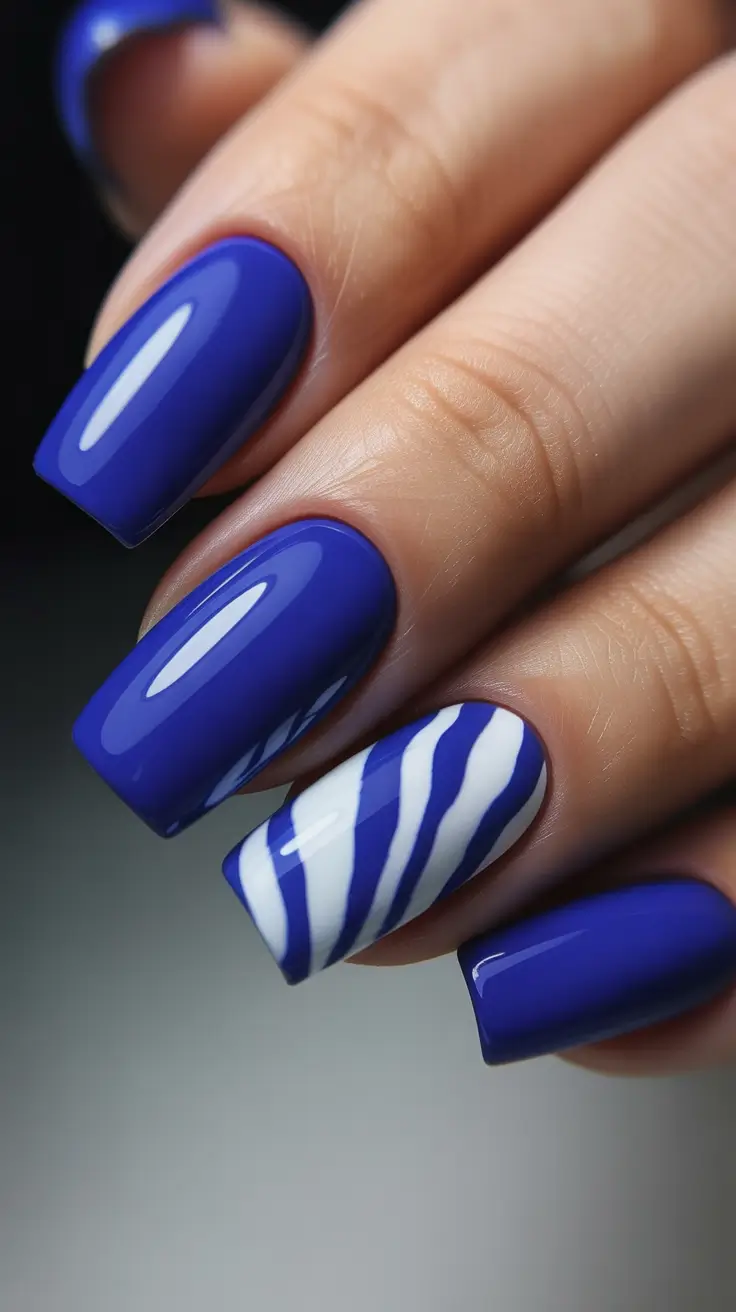 Blue Nail Trends for Winter 2025–2026 White and Blue Striped Boldness