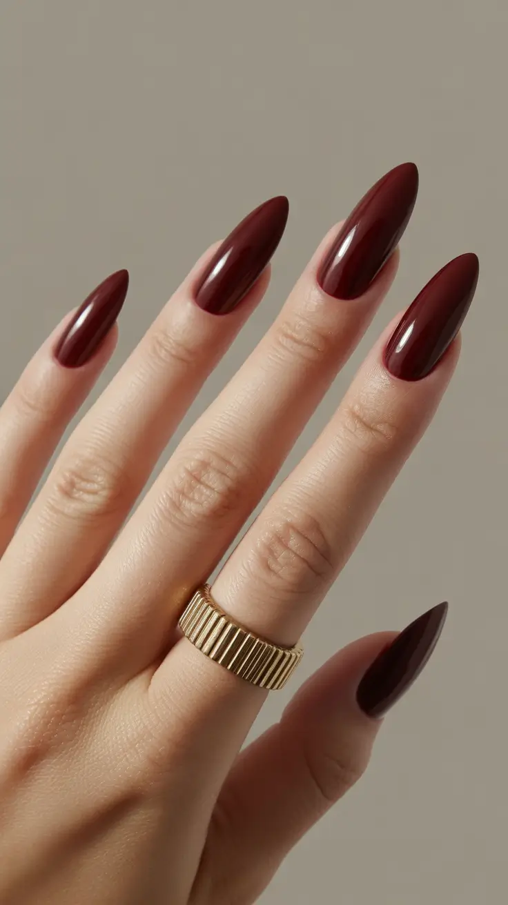 dark burgundy nails 2026 Garnet Almond Glow