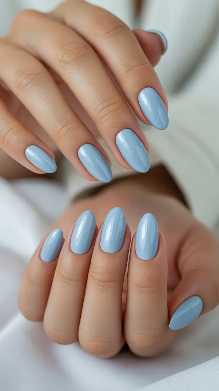 short almond nail designs 2026 Cloudy Blue Gloss for Soft, Clean Spring Energy