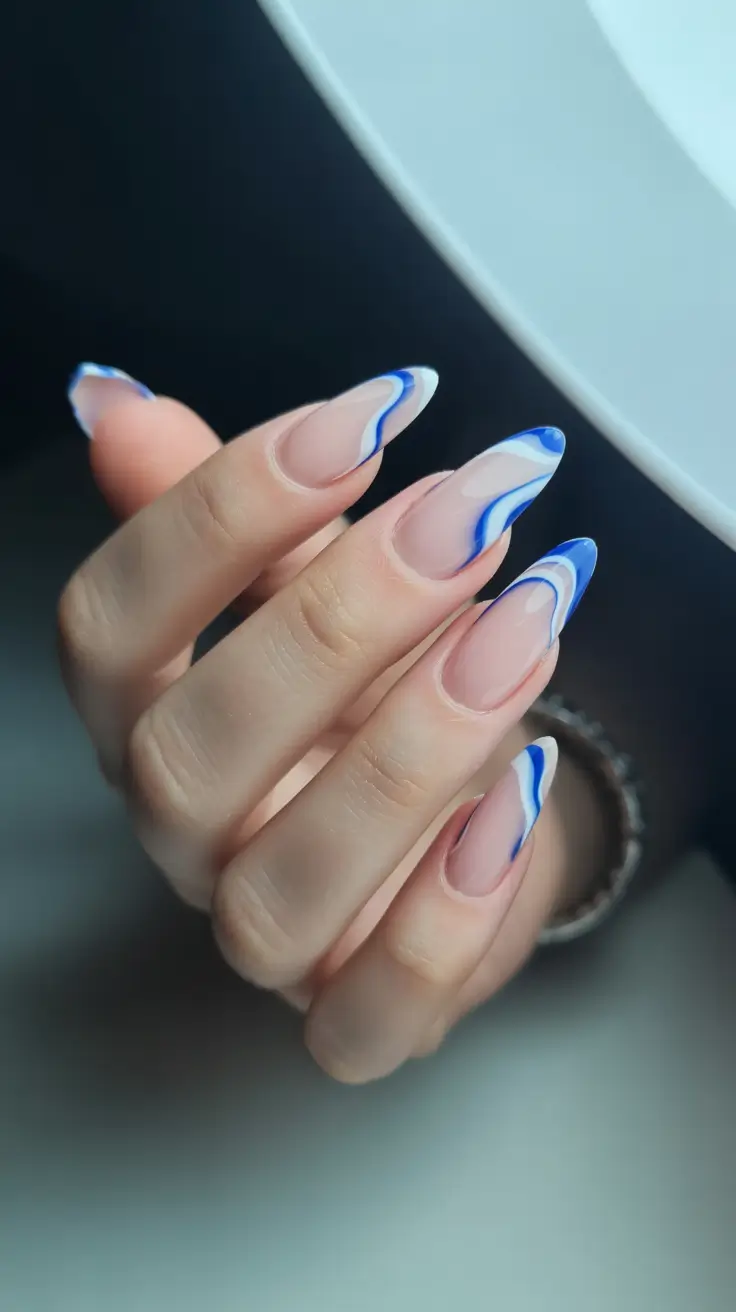 February-nails-designs-2026-Blue-Wave-Art-on-Almond-Tips