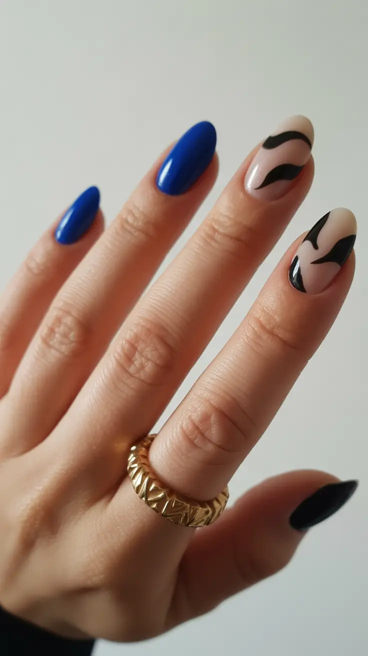 spring nail art 2026 Cobalt Blue Accent Nails with Abstract Black Art