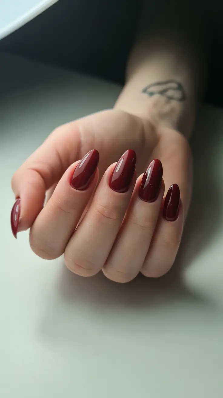 classy trendy spring nails 2026 Deep Burgundy Almond Nails for Sophisticated Spring Evenings