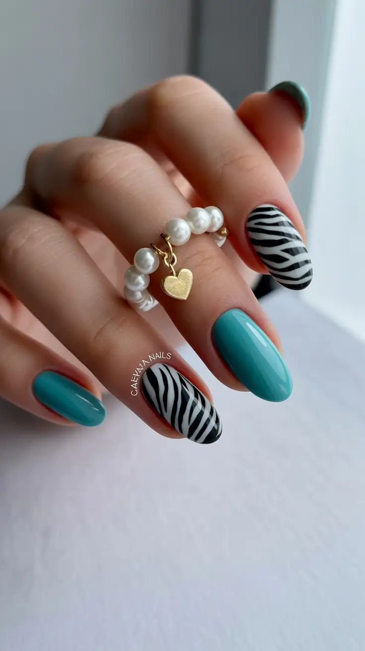 spring nail design 2026 turquoise zebra accent almond shape