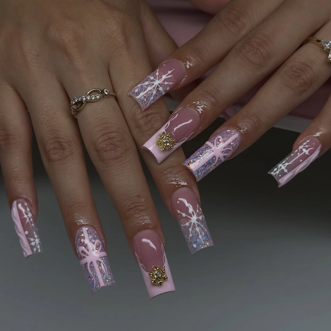 Long pink square nails with white snowflakes, lilac bows and silver glitter